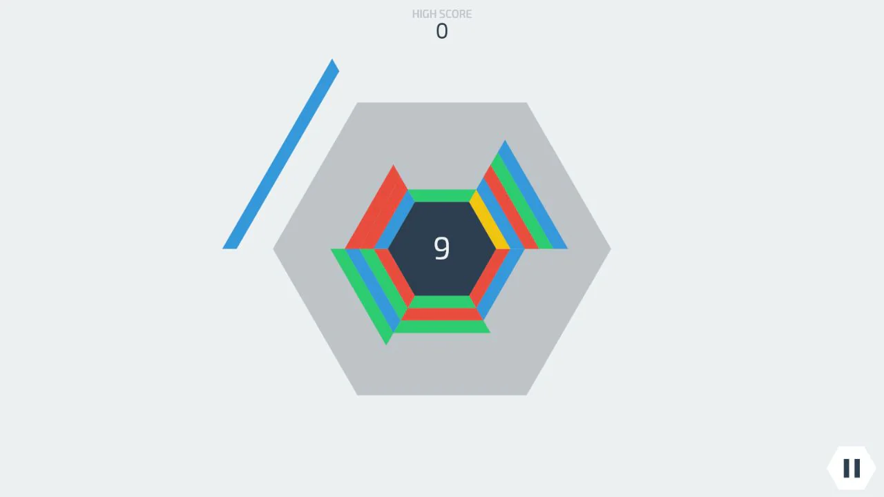 Hextrisでスコア9となり、中央の六角形の周囲へ青や黄や赤のブロックが積み上がった実プレイ画面